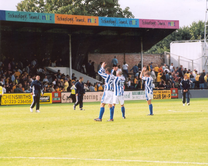 Players applaud the visiting fans, Cambridge Game 11 August 2001