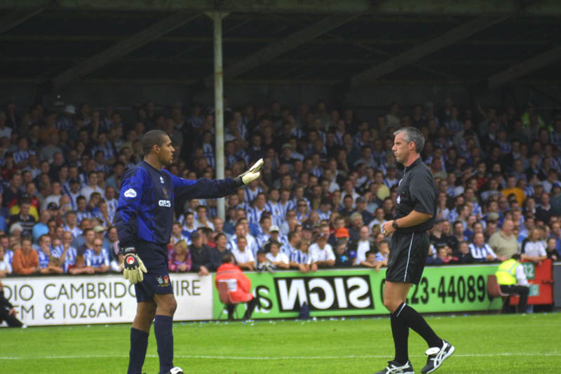 Kuipers trys to placate the ref after being threatend with a booking for complaining, Cambridge Game 11 August 2001