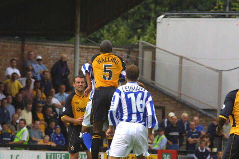 Lehmann looks on as Cambridge player climbs on the back of an Albion player, Cambridge Game 11 August 2001