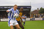 Simon Morgan controls the ball