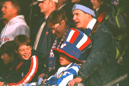 Young fan in a colourful hat, Chester city game 26 February 2000