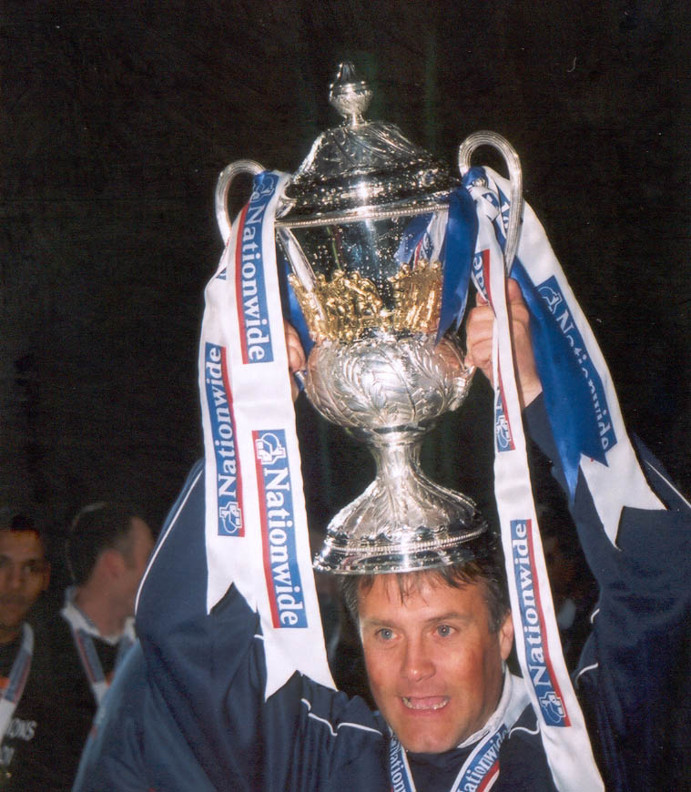 Micky poses with cup on head Chesterfield game 01 may 2001