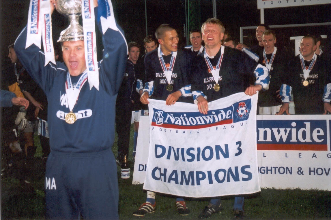 Micky poses with cup on head with Zamora and Rogers behind, Chesterfield game 01 may 2001