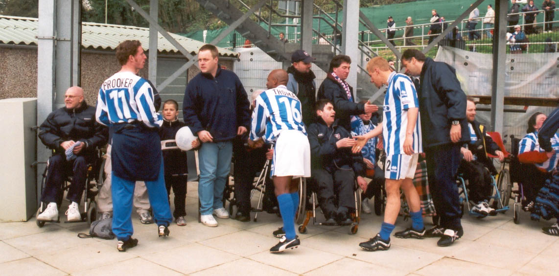 Brooker, Thomas and carpenter with disabled fans Darlington game 16 April 2001