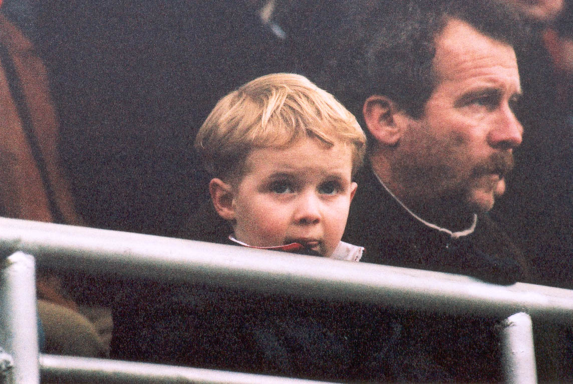 Call Childline 0800 1111, child cruelty like this should not be allowed, young orient fan looks on., Leyton Orient game 03 march 2001