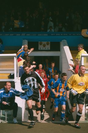 Mark Walton pats Mark Ormarod on the behind as the teams take the field, Shrewsbury Town game 29 April 2000